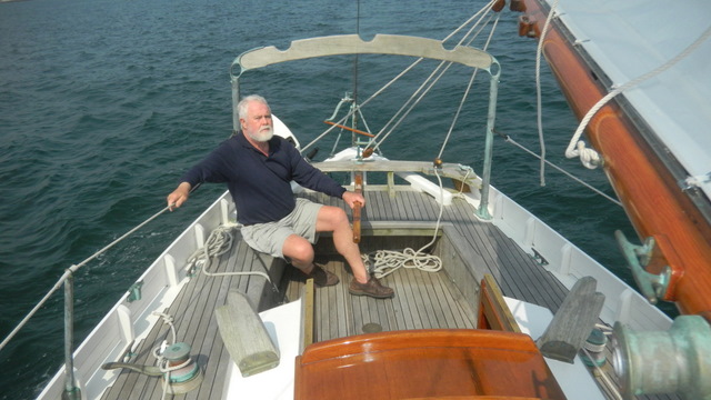 7. A special treat, Larry at the helm of our very first cruising boat, Seraffyn.jpg