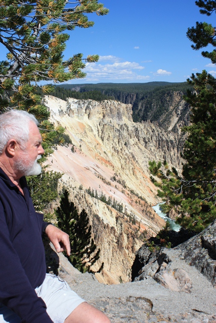 The stunning mountain parks of the Western US were part of our tour – that’s the Yellowstone river below Larry..jpg